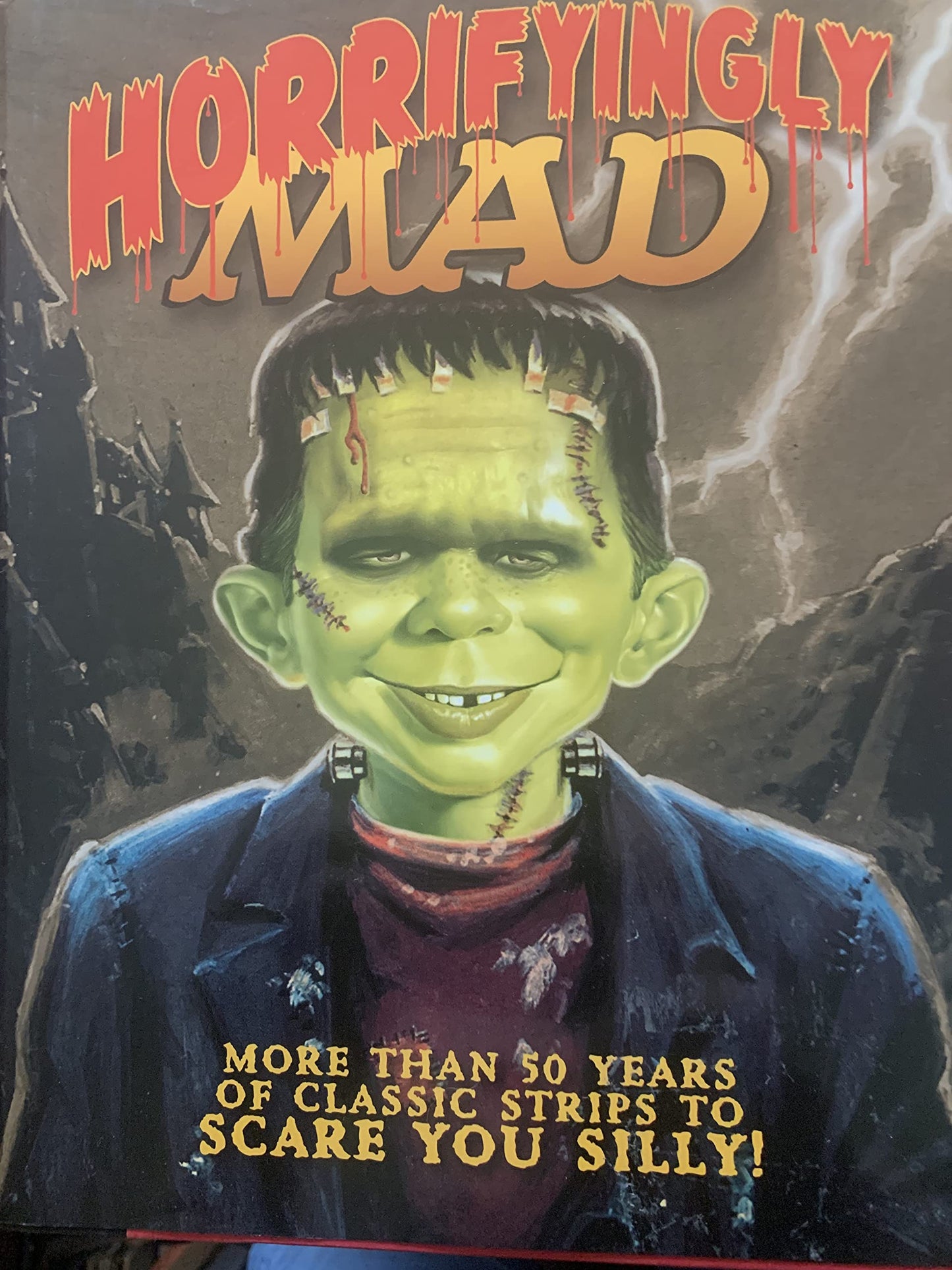 Horrifyingly Mad: More than 50 Years of Classic Strips to Scare you Silly! by Mad Staff (2011-05-04) The Happy Book Stack