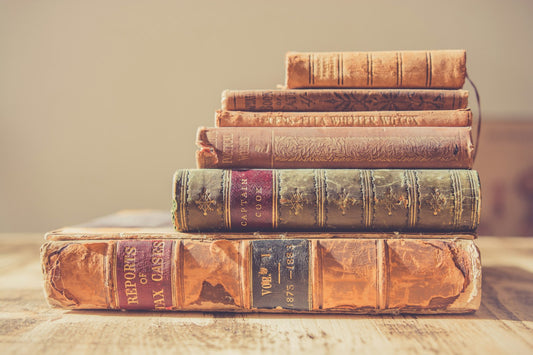 A stack of books – 100 Books Every Student Should Read Before Graduating High School
