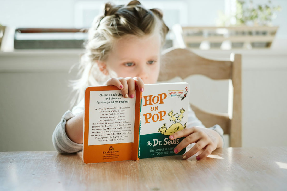 A girl sitting and reading a book – Best Books for 12-Year-Olds