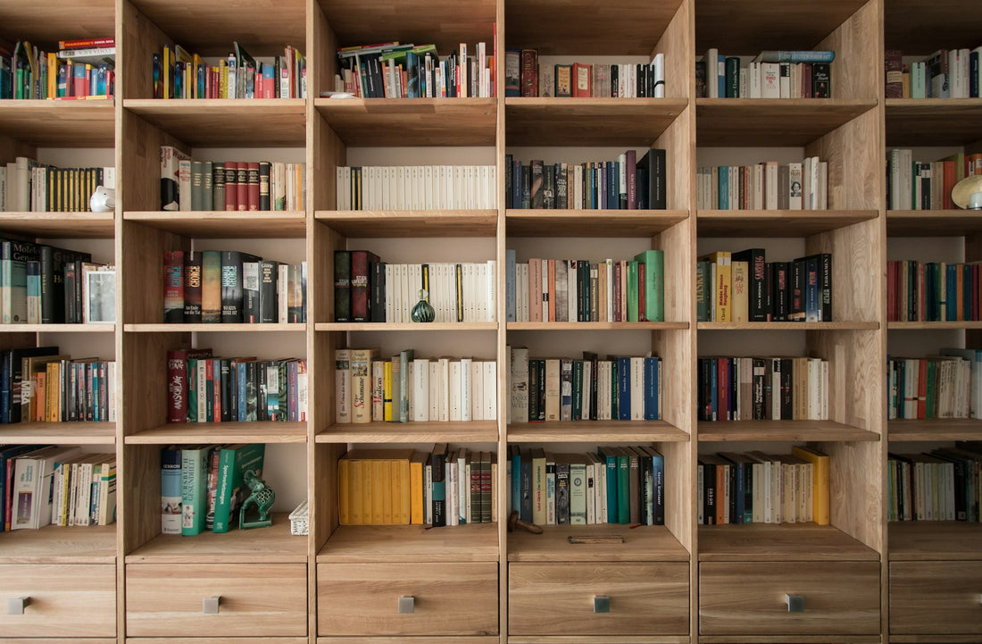 Books on a wooden bookshelf – Books Every Home Library Should Have