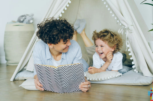 A mother reading a book to a child – Best Christian Books for Families