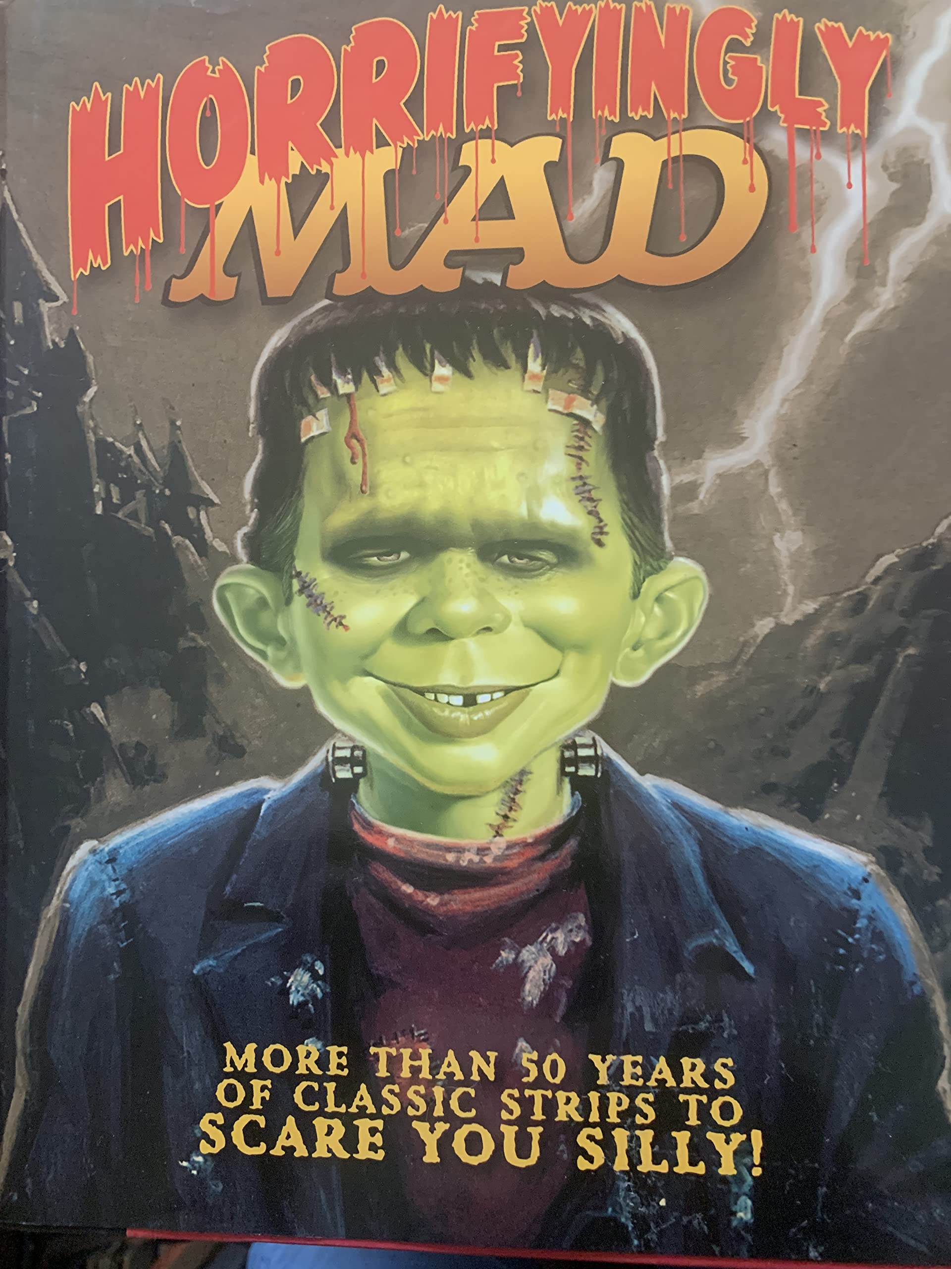 Horrifyingly Mad: More than 50 Years of Classic Strips to Scare you Silly! by Mad Staff (2011-05-04) The Happy Book Stack